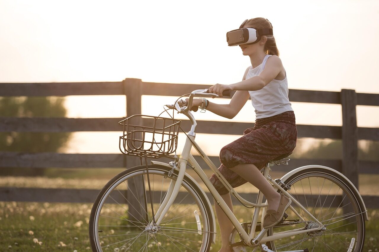 augmented reality, bicycle, girl, metaverse, bike, child, cyclist, fence, fun, outdoors, person, virtual reality, virtual reality glasses, virtual reality goggles, virtual reality headset, vr headset